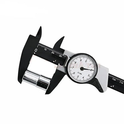 Black and white plastic vernier caliper showing 0-150mm scale with 0.1mm graduations