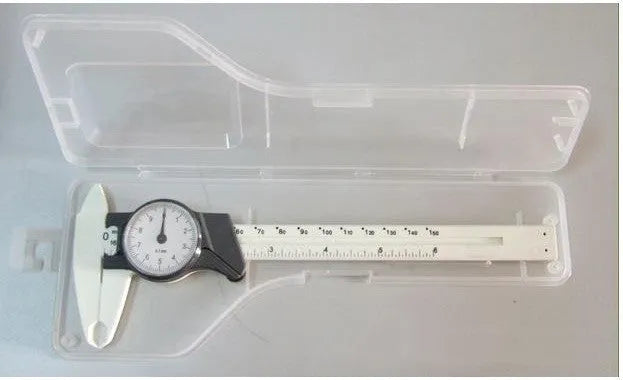 Black and white plastic vernier caliper showing 0-150mm scale with 0.1mm graduations