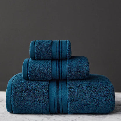Three-piece cotton towel set showing bath towel, towel, and square scarf in coordinating colours