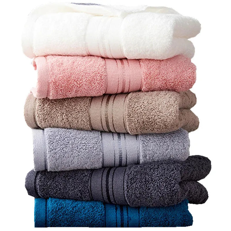 Three-piece cotton towel set showing bath towel, towel, and square scarf in coordinating colours