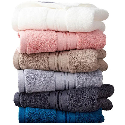Three-piece cotton towel set showing bath towel, towel, and square scarf in coordinating colours