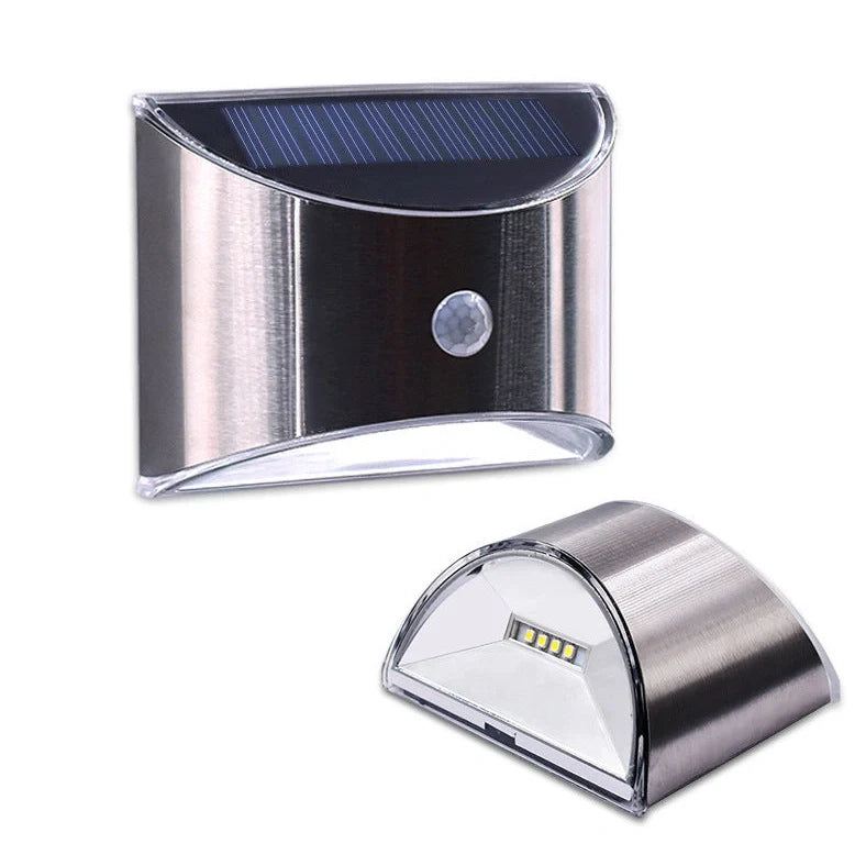 White solar step lights measuring 10cm long on outdoor brick steps with LED illumination