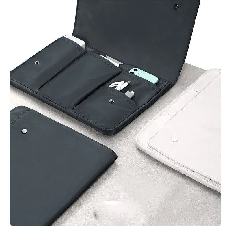 Nylon notebook liner bag with magnetic buckle, black or white, sizes 13, 14.1, 15.4, and 16 inches, for laptops and tablets.