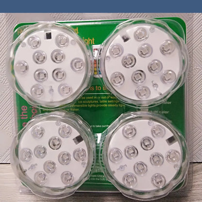 White waterproof remote control LED light with IP68 rating for pools and gardens.