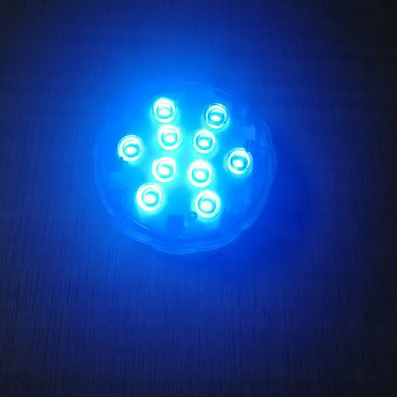 White waterproof remote control LED light with IP68 rating for pools and gardens.
