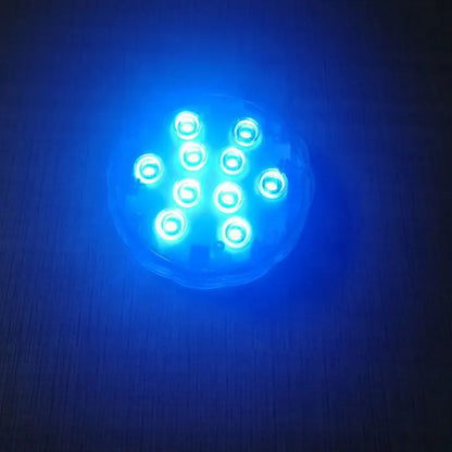 White waterproof remote control LED light with IP68 rating for pools and gardens.