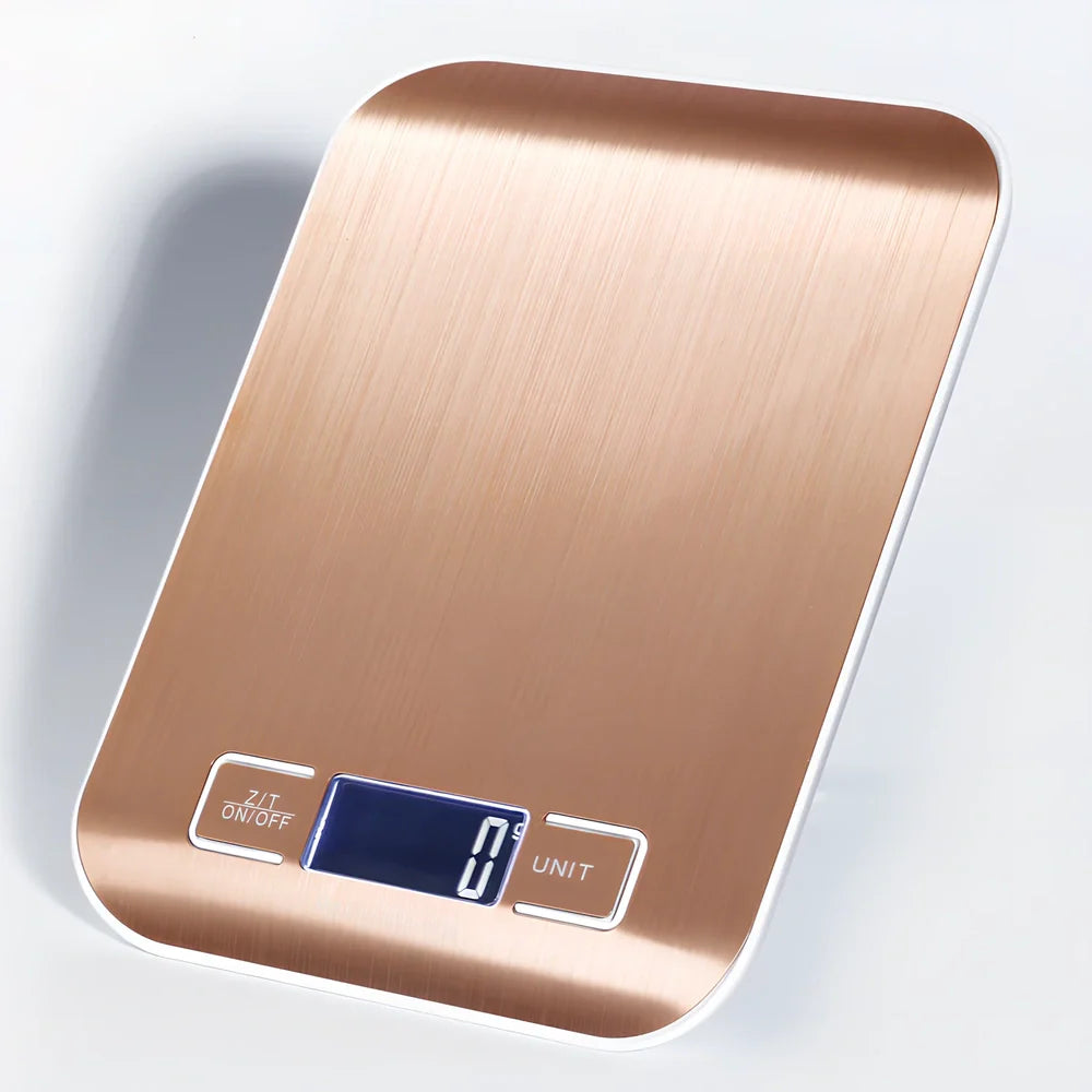Gold stainless steel kitchen scale with electronic display showing weight measurement