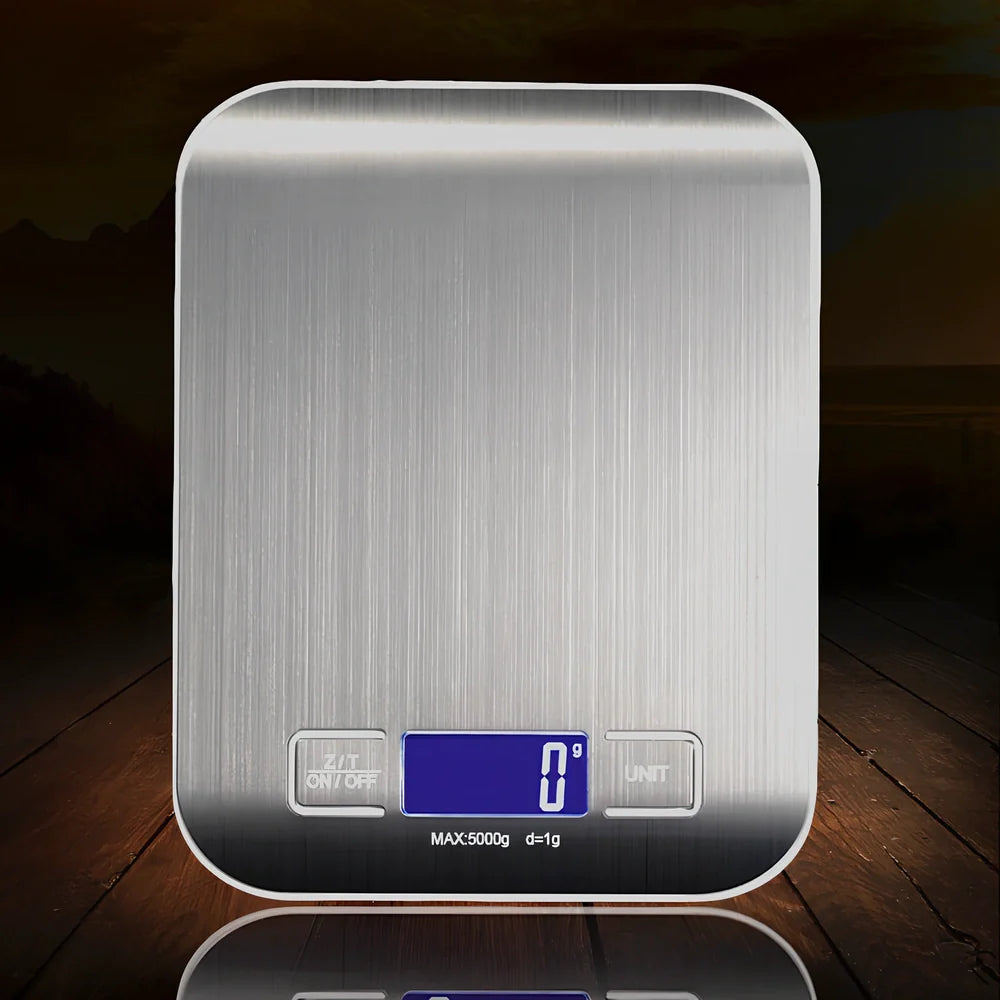Gold stainless steel kitchen scale with electronic display showing weight measurement