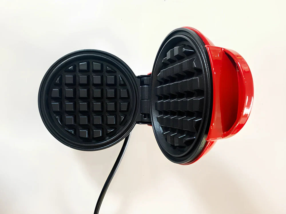 Red electric waffle maker measuring 10x15x20cm with EU plug for bubble egg cakes and pancakes
