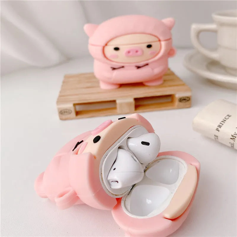 Pink silicone pig earphone case with flip lid and carabiner hook for Apple AirPods.