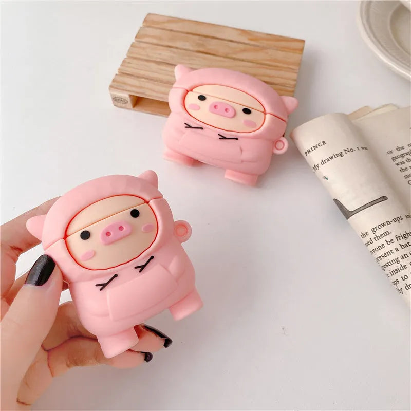 Pink silicone pig earphone case with flip lid and carabiner hook for Apple AirPods.