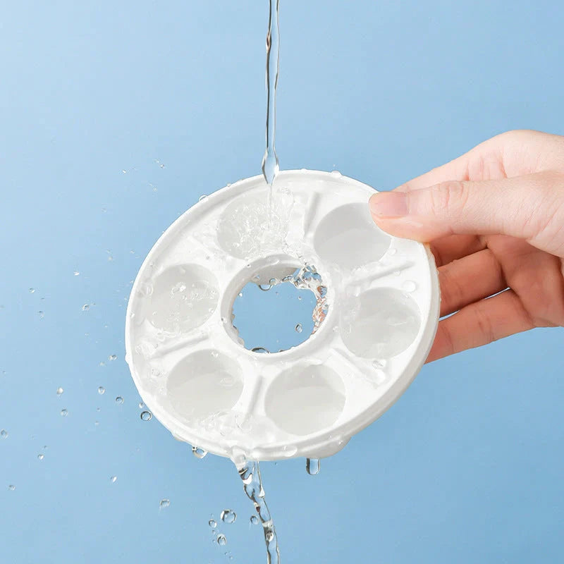 Donut-shaped ice cube molds in orange and blue, perfect for creative drink presentation.