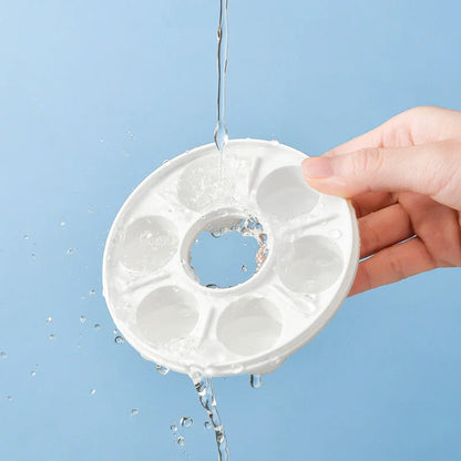 Donut-shaped ice cube molds in orange and blue, perfect for creative drink presentation.