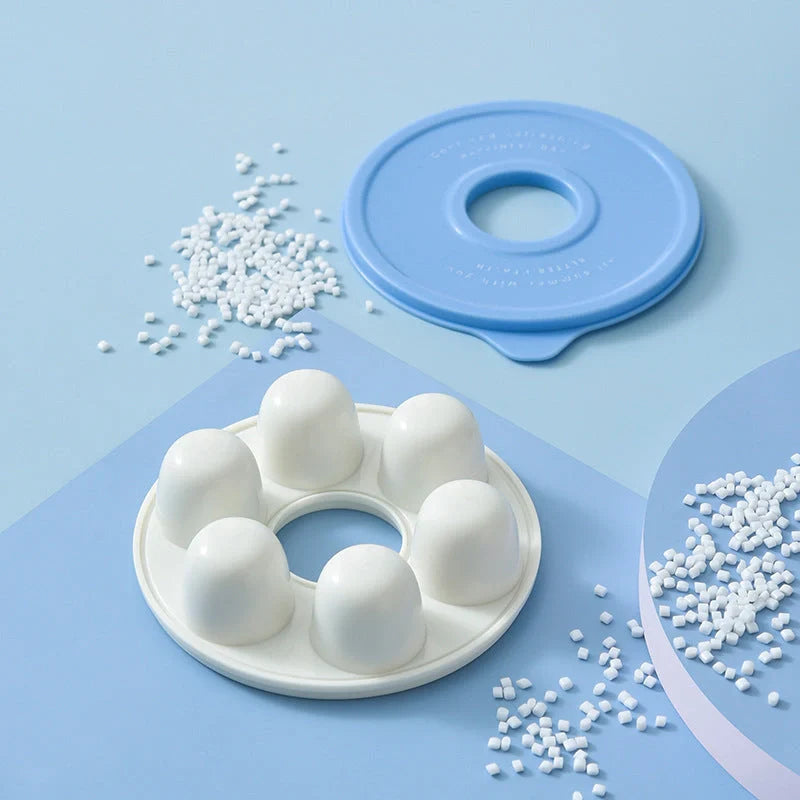 Donut-shaped ice cube molds in orange and blue, perfect for creative drink presentation.