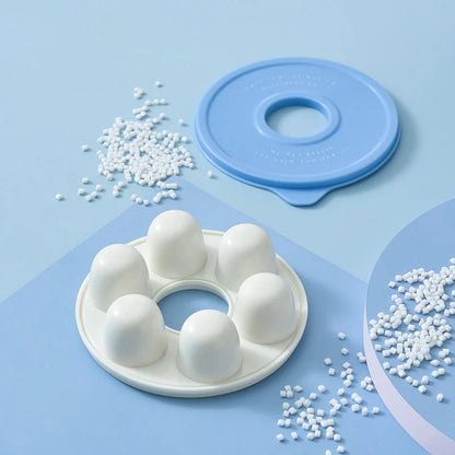 Donut-shaped ice cube molds in orange and blue, perfect for creative drink presentation.