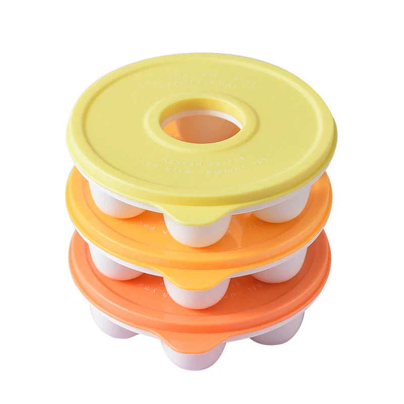 Donut-shaped ice cube molds in orange and blue, perfect for creative drink presentation.