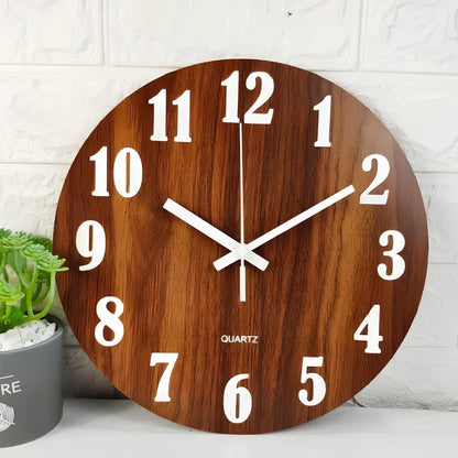 Round wood grain luminous wall clock with glowing numbers in dark room setting