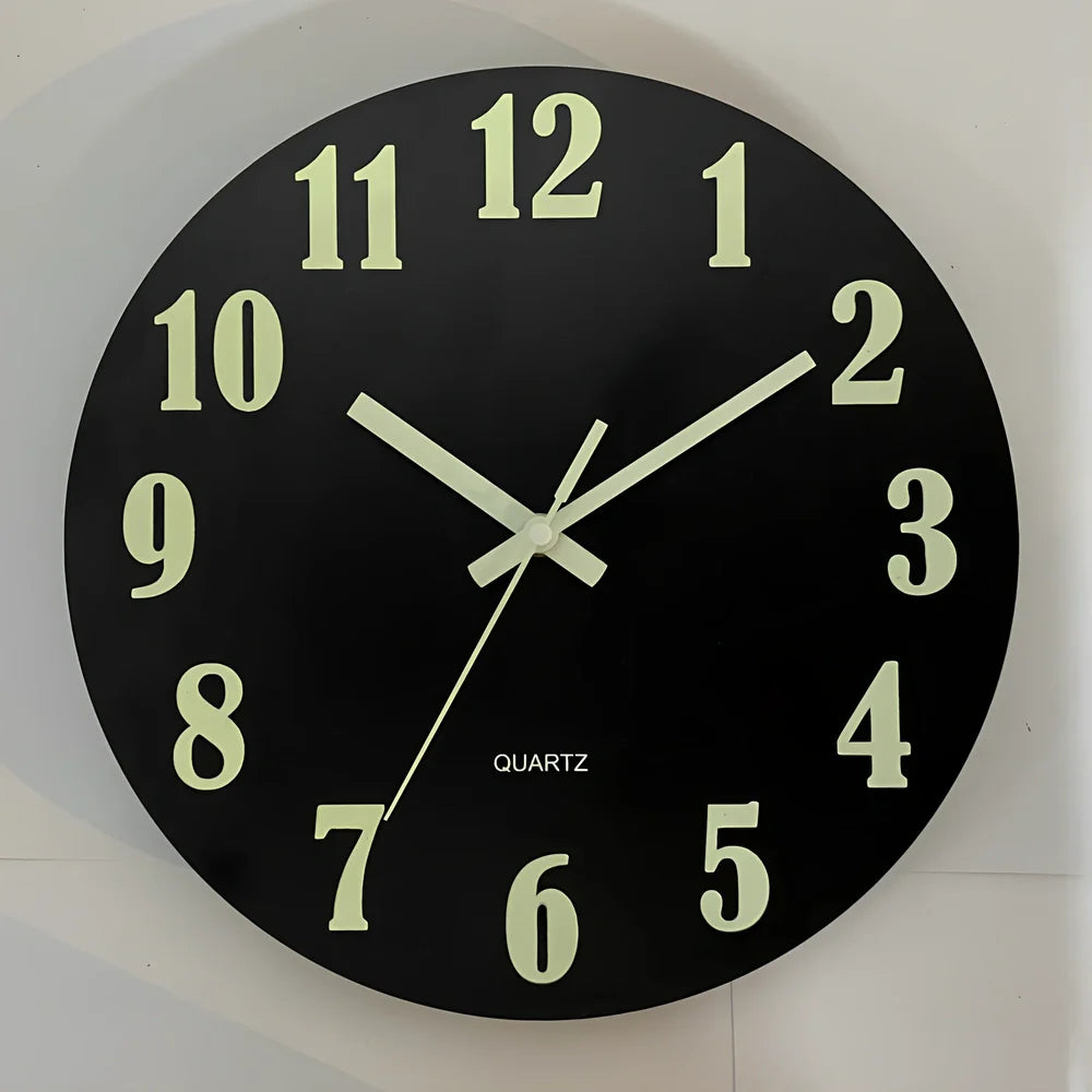 Round wood grain luminous wall clock with glowing numbers in dark room setting
