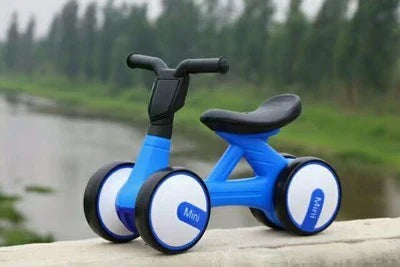 A stylish no-pedal balance bike with three wheels, vibrant colors, and optional light-up and music features for kids