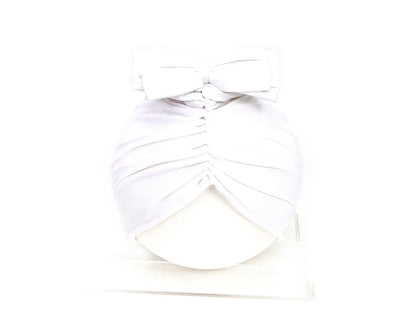 Soft acrylic knitted baby cap for newborns and toddlers in a solid colour, showing stretch fit.