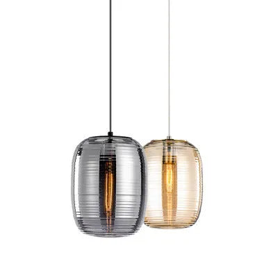 Transparent glass table lamp with modern Nordic design in cognac colour on wooden surface