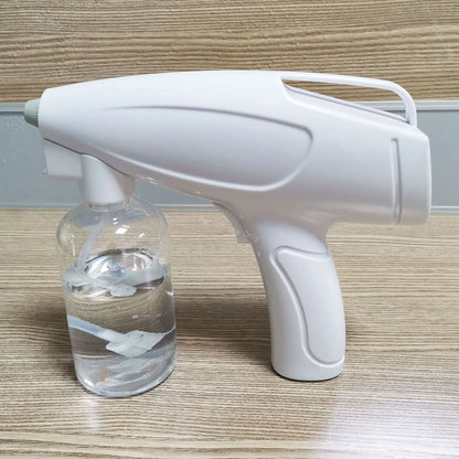 White handheld cordless electric spray gun with USB Type-C charging port and trigger.