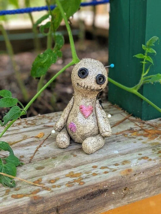 Handcrafted voodoo doll cone incense burner with smoke effect from eyes and mouth