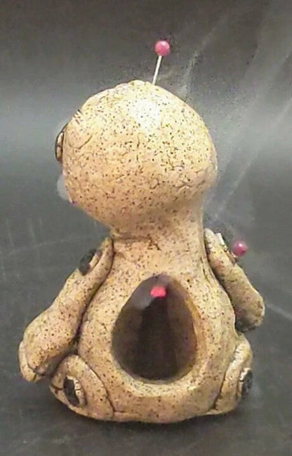 Handcrafted voodoo doll cone incense burner with smoke effect from eyes and mouth