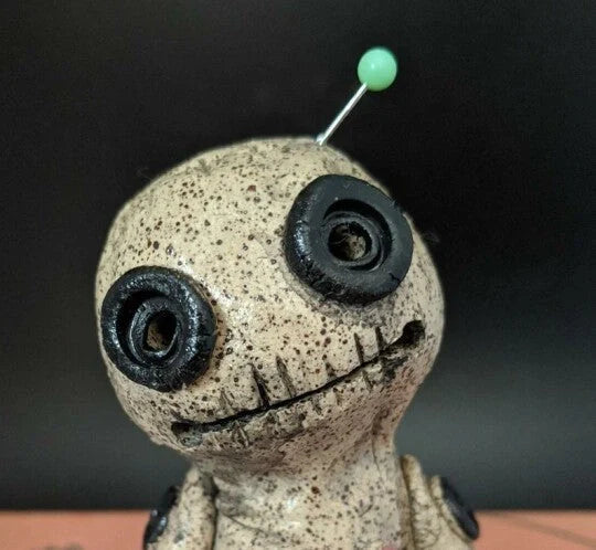 Handcrafted voodoo doll cone incense burner with smoke effect from eyes and mouth