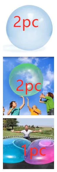 Large pink, yellow, green, and blue inflatable bouncy balls in various sizes for children's play.