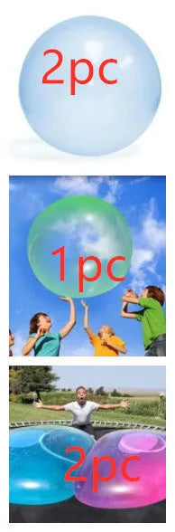 Large pink, yellow, green, and blue inflatable bouncy balls in various sizes for children's play.