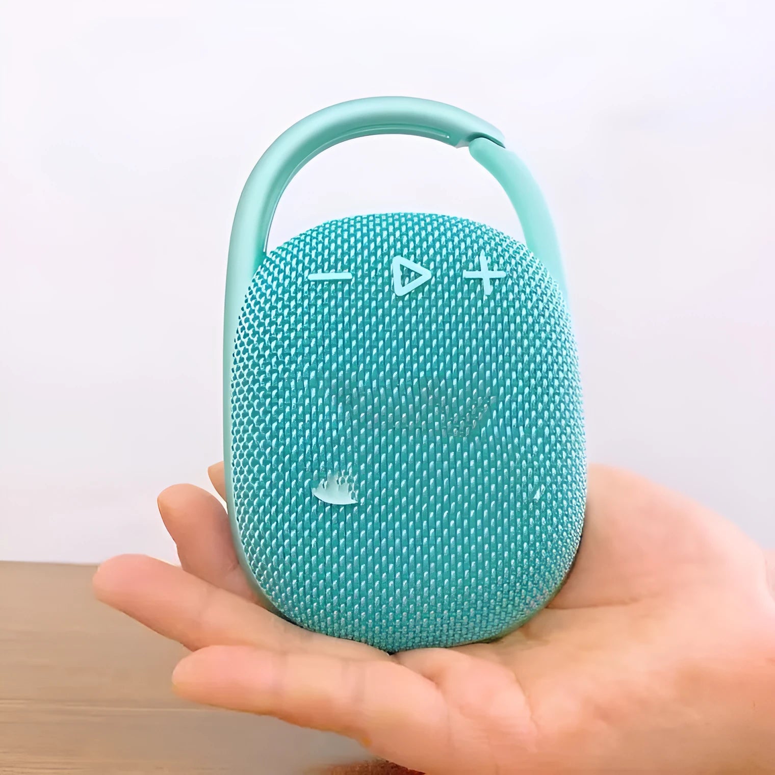 Compact 4th generation wireless Bluetooth speaker in silver grey colour with USB charging port and front grille.