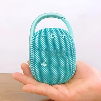 Compact 4th generation wireless Bluetooth speaker in silver grey colour with USB charging port and front grille.