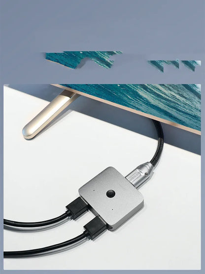 Grey HDMI splitter device with one input and two output ports for screen duplication