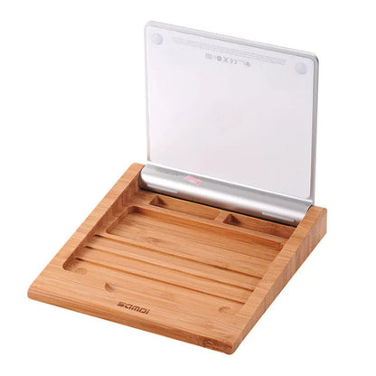 Bamboo wood stand holding an Apple tablet and an Apple Bluetooth trackpad side by side.