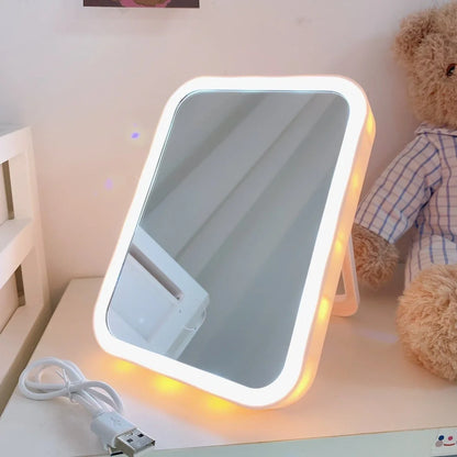 Japanese LED desktop vanity mirror folded showing white plastic frame and USB power port