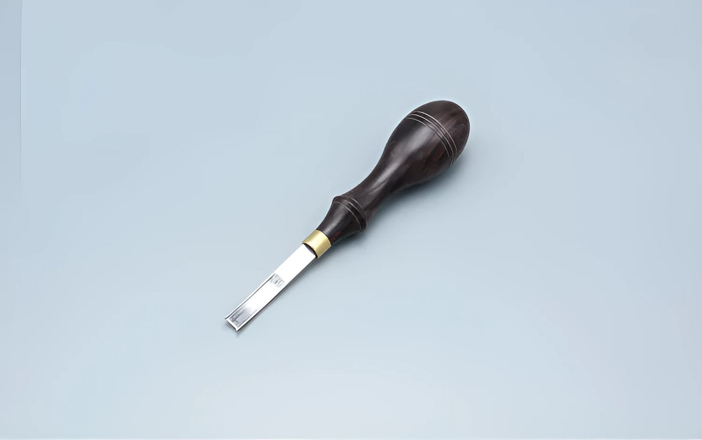 Leather crafting wide shovel edge thinning knife and drum shovel hand tool.