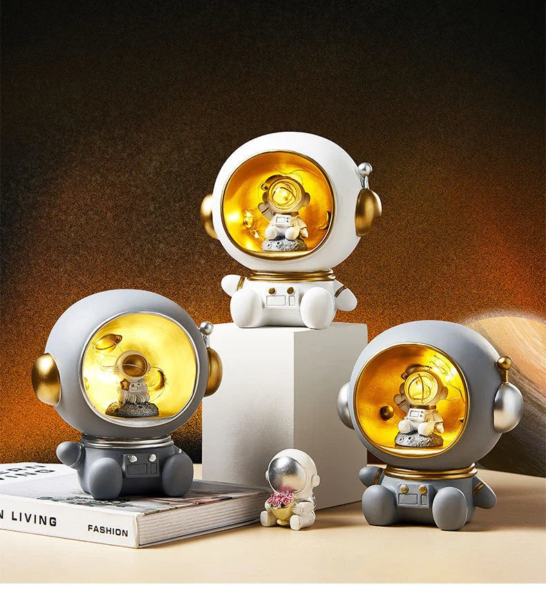 Astronaut-themed resin piggy bank with LED night light feature