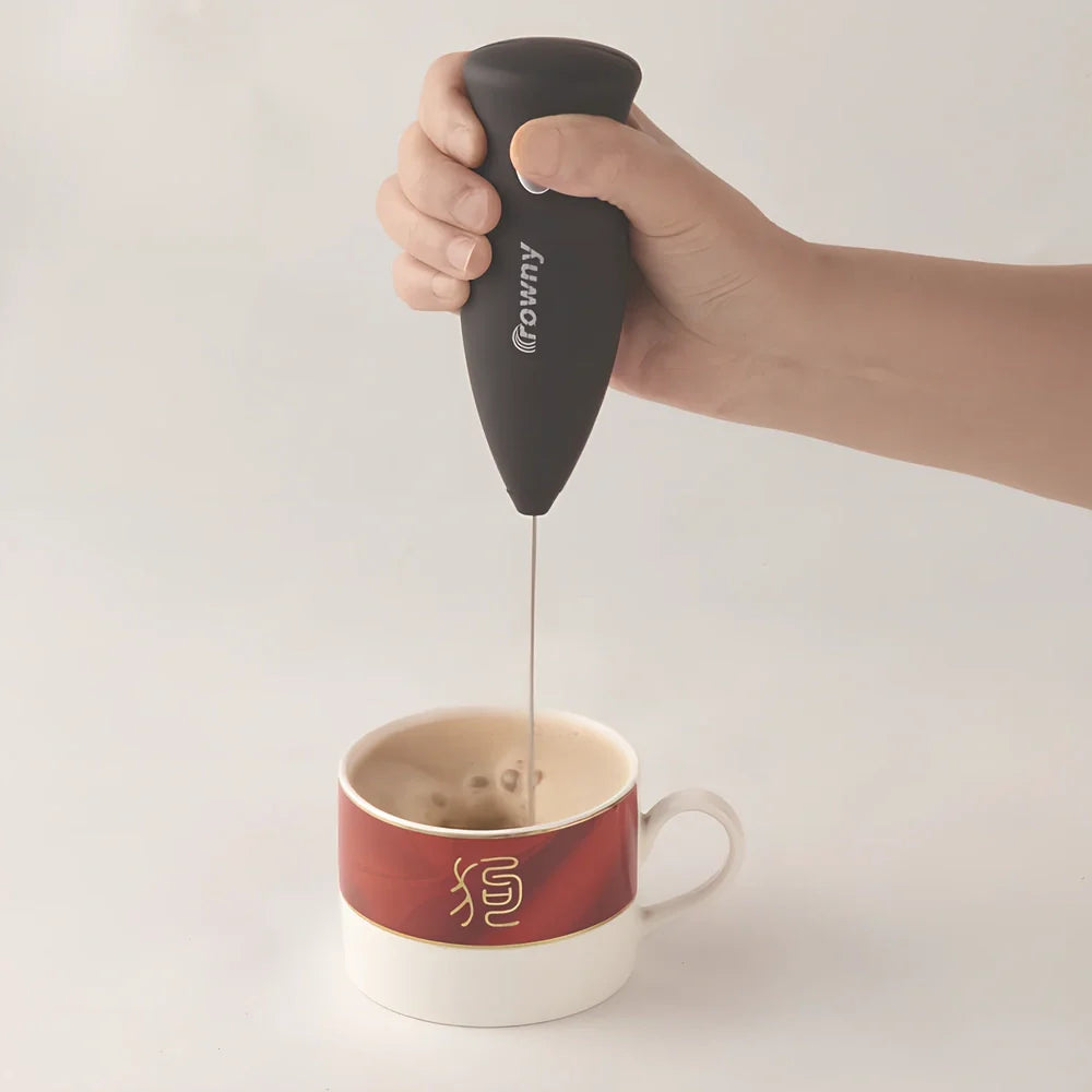 Black handheld electric milk frother with 3-speed control and stainless whisk for eggs and coffee, 20cm long