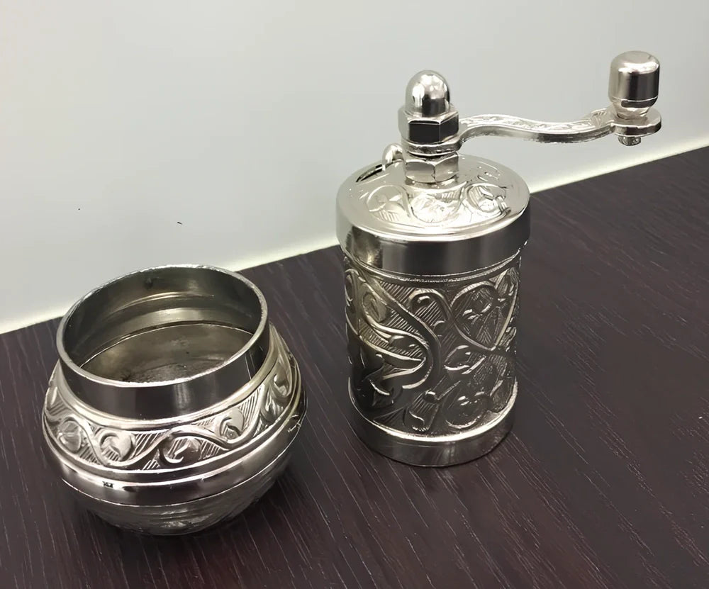Turkish manual coffee grinder with removable ceramic burrs and compact 15cm height design