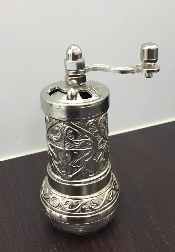 Turkish manual coffee grinder with removable ceramic burrs and compact 15cm height design