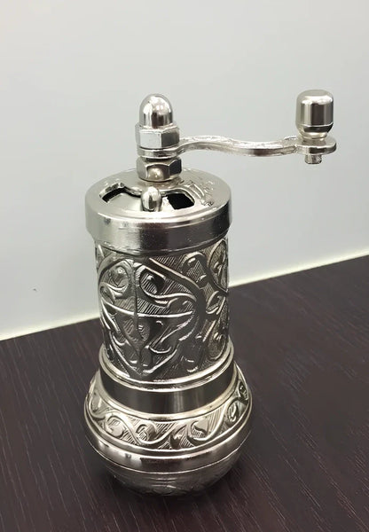 Turkish manual coffee grinder with removable ceramic burrs and compact 15cm height design