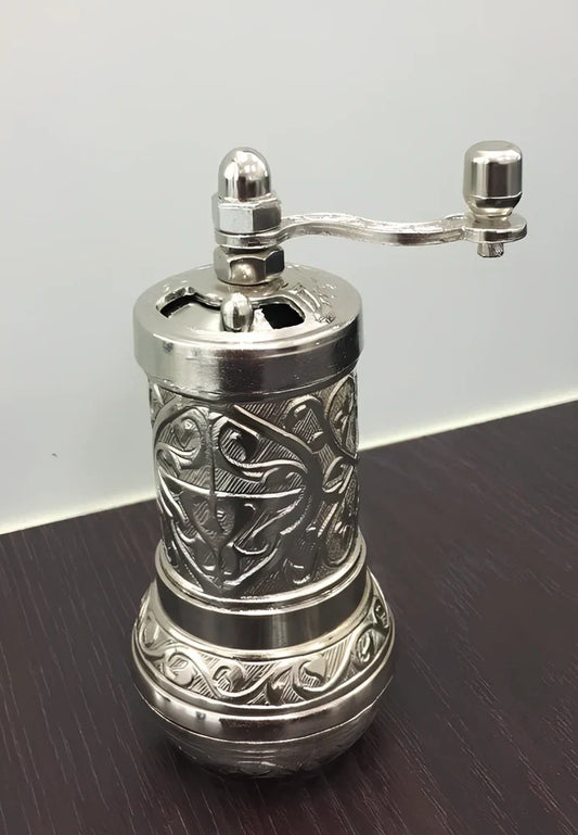 Turkish manual coffee grinder with removable ceramic burrs and compact 15cm height design