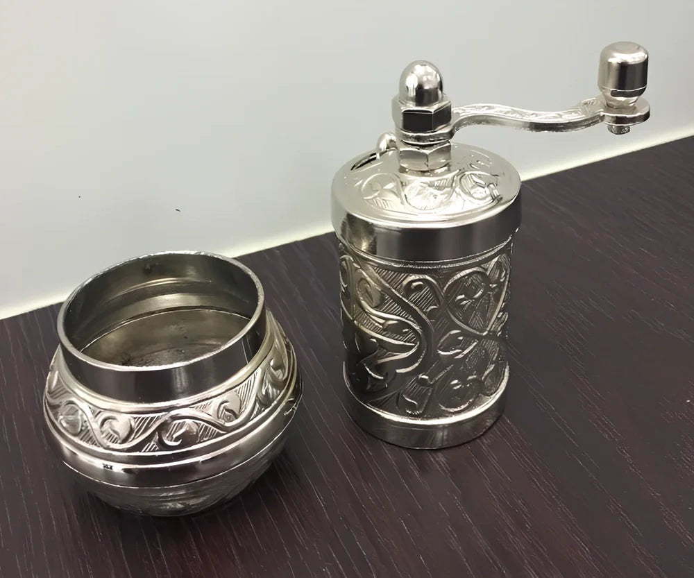 Turkish manual coffee grinder with removable ceramic burrs and compact 15cm height design