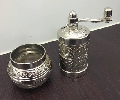 Turkish manual coffee grinder with removable ceramic burrs and compact 15cm height design