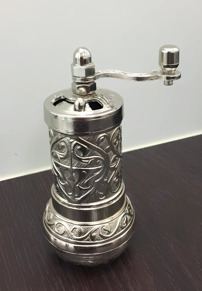Turkish manual coffee grinder with removable ceramic burrs and compact 15cm height design