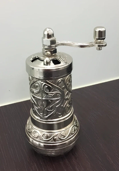 Turkish manual coffee grinder with removable ceramic burrs and compact 15cm height design