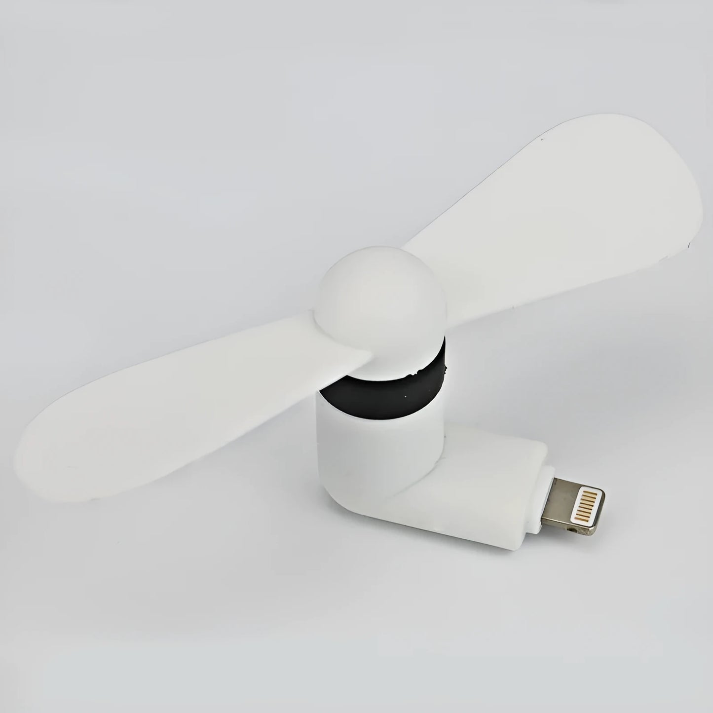 White portable mobile phone mini fan with plastic blades attached to smartphone