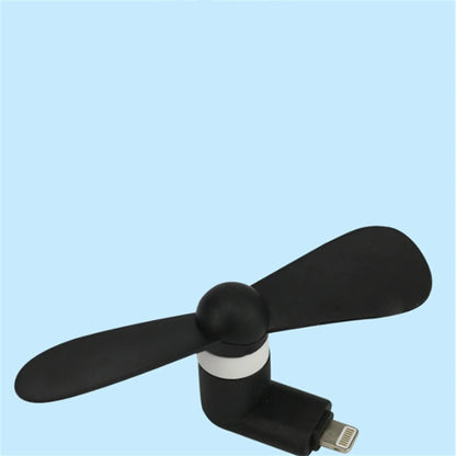 White portable mobile phone mini fan with plastic blades attached to smartphone