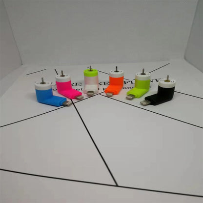 White portable mobile phone mini fan with plastic blades attached to smartphone